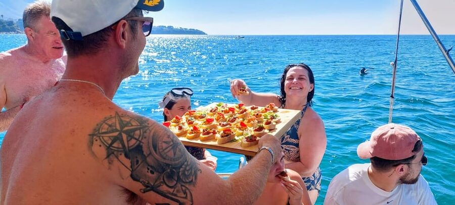 Cefalù: Mini Yacht with Snorkel Stops, Caves and Aperitif - Aperitivo, prosecco, and a little boat-side fun