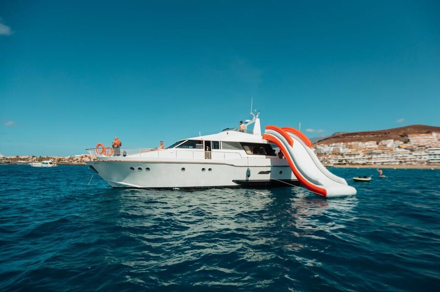 Costa Adeje: Private Yacht Trip with Watersports and Slides - The 1.5-hour coastal outing toward Los Cristianos