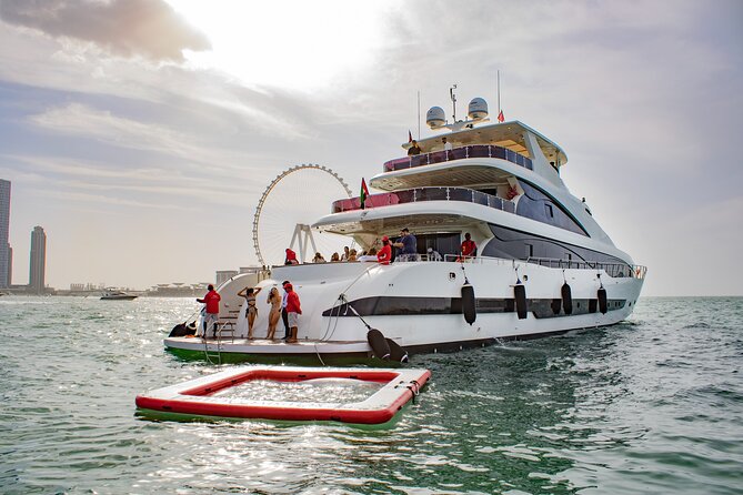 Dubai Harbour Super Yacht Experience with gourmet & Drinks - The DJ, swimming stop, and onboard rhythm