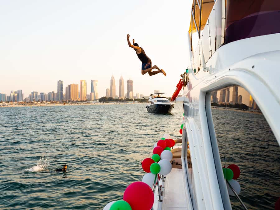 Dubai: Yacht Cruise with Swimming, Snorkeling and BBQ Lunch - Slides, Pool, and Optional Jet Skis