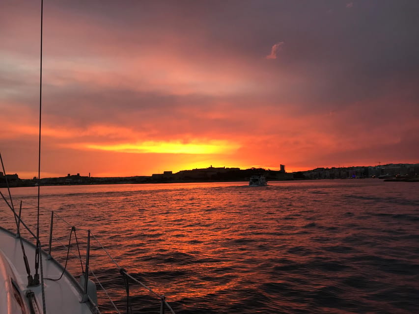 From Valletta: Romantic Sunset Cruise on a Sailing Yacht - Valletta after dark