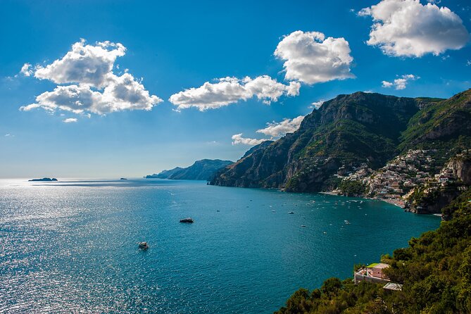 Half Day in Amalfi Coast with Private Luxury Yacht Tour - Praiano from the water, with beaches and a painted dome