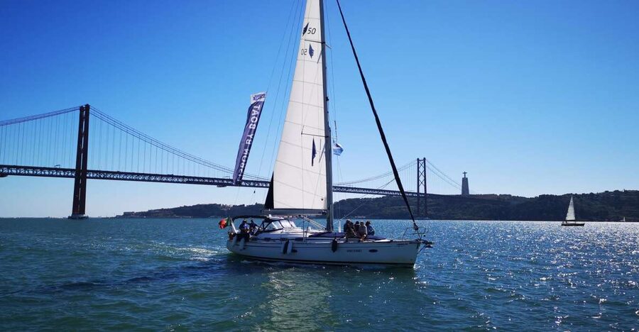 Lisbon: 2-Hour Sailing Yacht Cruise & Guided Tour w/2 drinks - Crossing the Tagus toward the Vasco da Gama Bridge