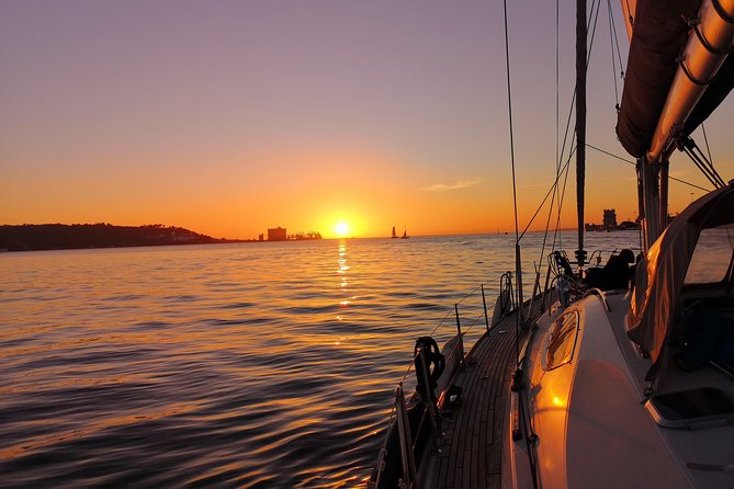Lisbon Sunset Sailing Tour on Luxury Sailing Yacht with 2 Drinks - Portuguese wine, beer, cheese, and the sunset hour