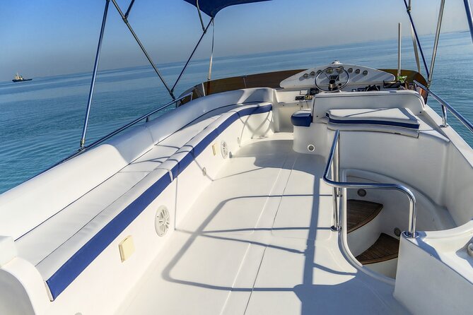 MY Cruises for Luxury Yacht Rental - Swimming, sitting on deck, and bringing drinks