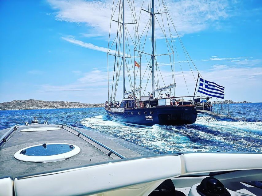Mykonos: Yacht Cruise to Rhenia and Guided Tour of Delos - Rhenia: clear water, a quiet bay, and lunch onboard