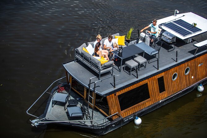 Prague YachtBoat CLASSIC cruise with Unlimited Beer or Prosecco - The first views: Dancing House and National Theatre