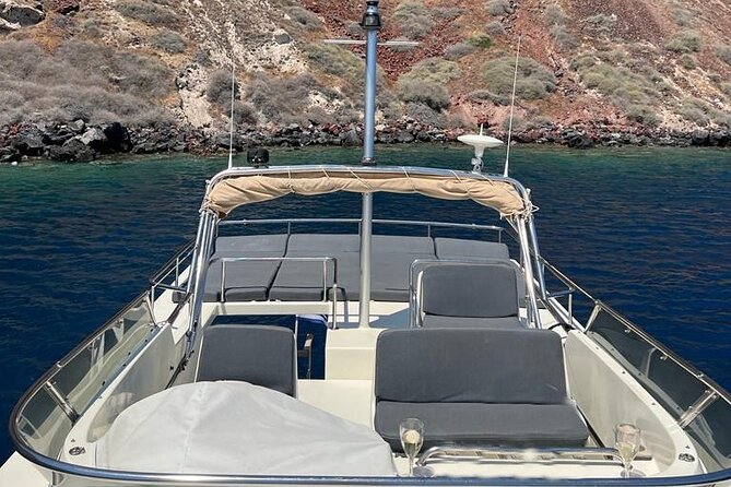 Private Full-Day Motor Yacht Cruise with Meal, Open Bar+Transfers - Sailing beneath Oia in the afternoon