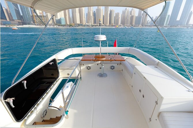 Private Yacht Cruising Rental from Dubai Marina - Using the grill and arranging food
