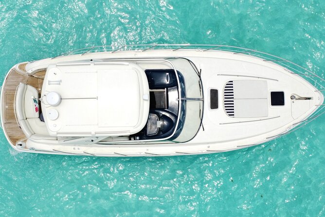 Private Yacht Rental in Cancun - Anchoring in clear water near Isla Mujeres