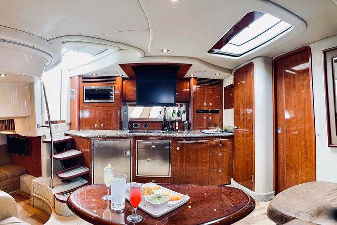 Private Yacht Sea Ray all-inclusive charter in Cabo - Médano Beach, snacks, and the open bar