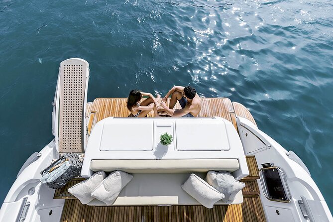 Santorini Caldera: Private Flybridge Yacht Experience - Mesa Pigadia offers clear water and dark rock