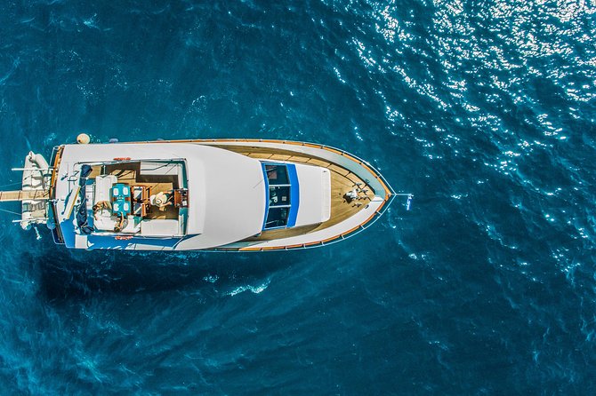 Santorini: Motor Yacht Private Cruise with 5-Course Meal - Leaving Vlihada for Santorini’s southern coast