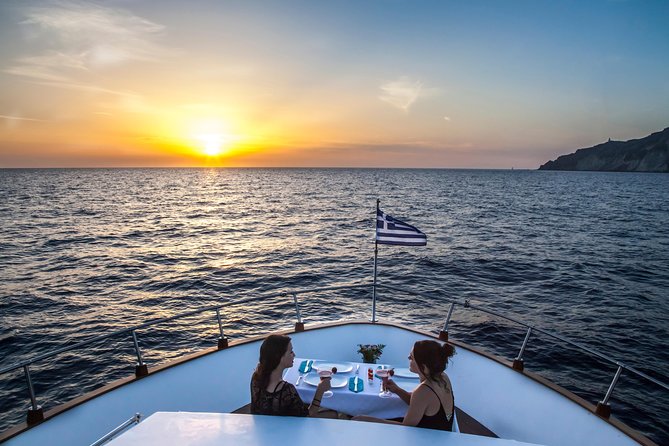 Santorini: Motor Yacht Private Cruise with 5-Course Meal - White Beach and the changing volcanic colors