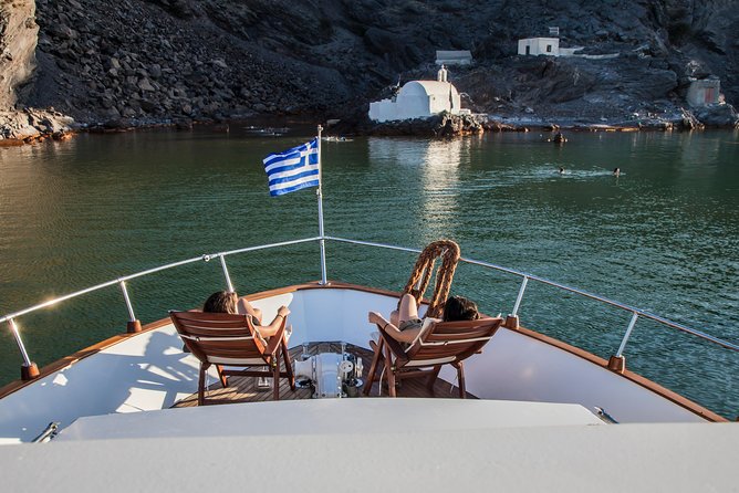 Santorini: Motor Yacht Private Cruise with 5-Course Meal - Red Beach and the Akrotiri coast