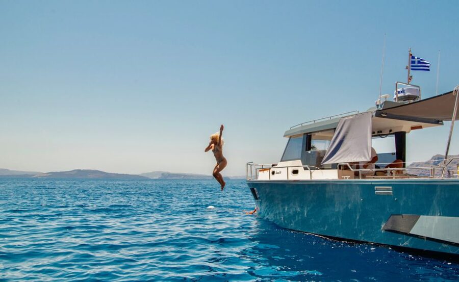 Santorini: Private Diamond 36 Motor Yacht Caldera Cruise - Leaving Ammoudi Bay for the caldera