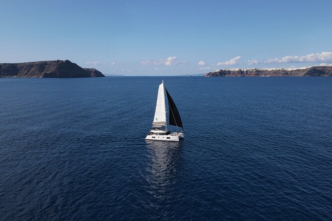 Santorini Private Tour Half-Day Sailing Platinum Catamaran Cruise - Red Beach: Santorini’s famous iron-red cliffs