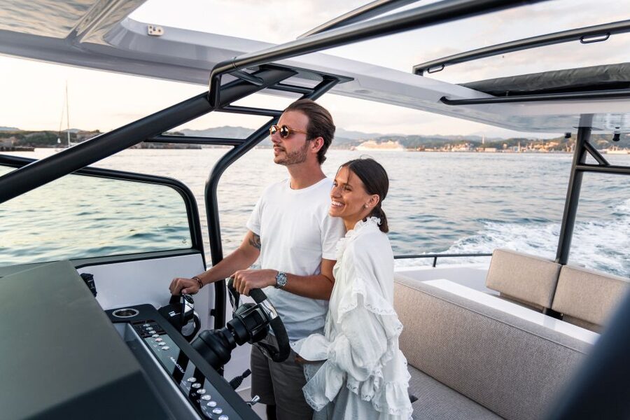 The Fastest All Inclusive Private Motor Yacht in Santorini - Oia from below the famous cliffs